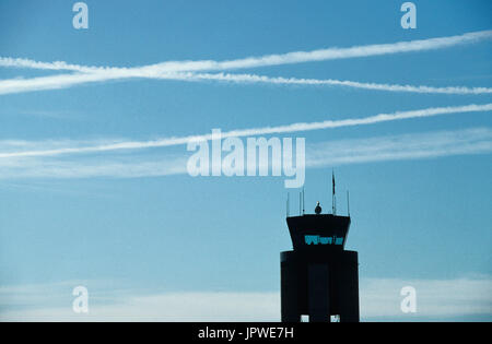 multiple airliners contrails over the air-traffic control-tower at Las Vegas International Stock Photo