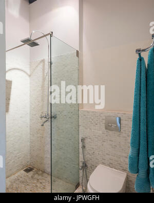 White bathroom with blue towel Stock Photo