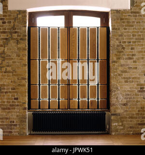 Wooden divider in front of window Stock Photo