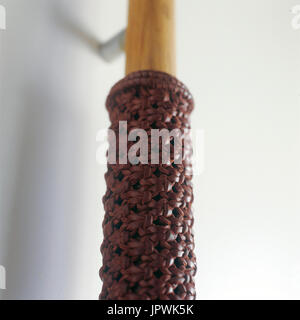 Woven leather detail on a door handle Stock Photo