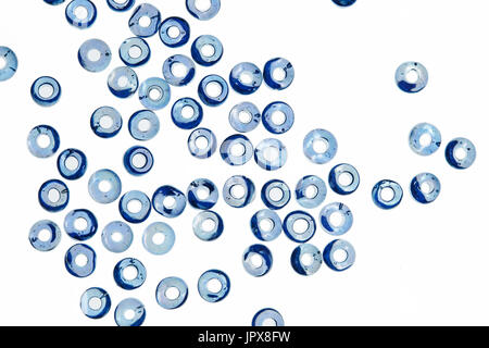 Blue glass beads isolated on white background. Stock Photo
