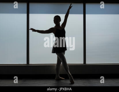 Ballet dancer Silhouette in a Window frame Stock Photo