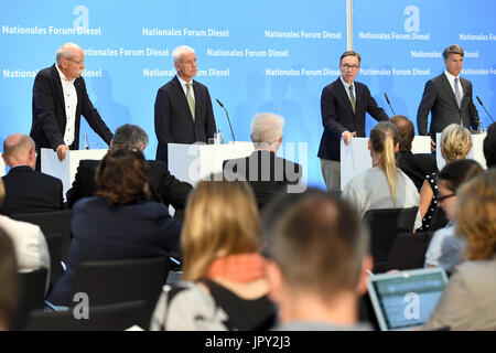 Berlin, Germany. 2nd Aug, 2017. Chairman of the board of Volkswagen Dieter Zetsche (L-R), chairman of the board of Volkswagen AG Matthias Wissmann, president of the German Automobile Industry Association (VdA) Matthias Wissmann, and chairman of the baord of BMW boss Harald Krueger speak during a press conference after the diesel summit in Berlin, Germany, on 2 August, 2017. The aim of the summit was to avoid a ban on diesel vehicles in towns. Credit: dpa picture alliance/Alamy Live News Stock Photo