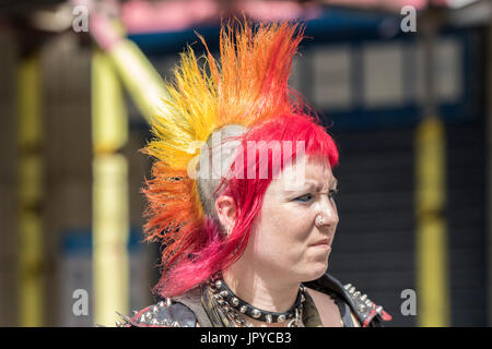 A woman punk rock rebel rebelling rebellion Blackpool festival spike spiked spiky Mohican, mohawk hair hairstyle outlaw steampunk rocker, UK Stock Photo