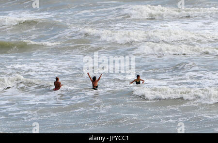 Brighton, UK. 3rd Aug, 2017. Swimmers in the sea off Brighton beach as the unsettled summer weather continues on the south coast but it is forecast to improve over the next few days Credit: Simon Dack/Alamy Live News Stock Photo