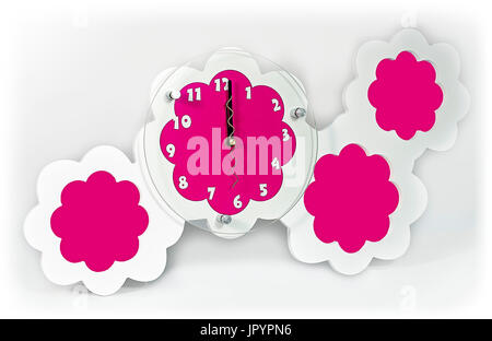 White pink wall clock with photo frames. Stock Photo