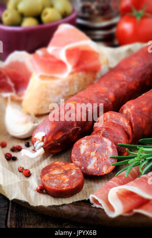Spanish Tapas with tomatoes and cured Slices of jamon iberico ham ...