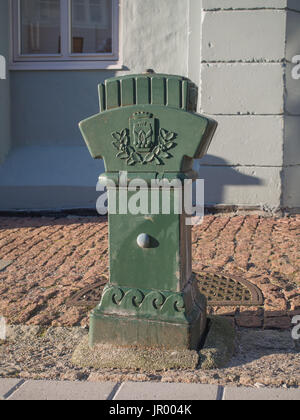 Bergen, Norway - February 12, 2017: Green, decorative hydrant on Bergen Street Stock Photo