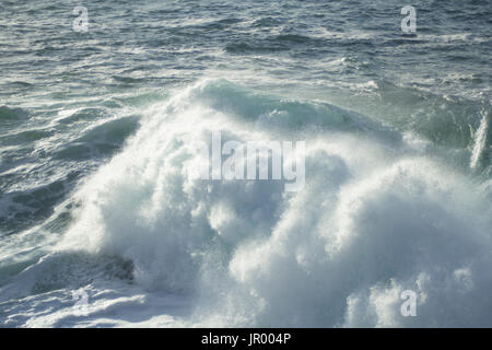 Ocean waves crashing on shore in Cornwall Stock Photo
