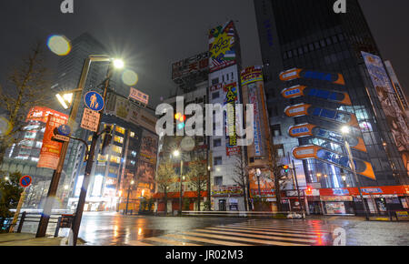 TOKYO, JAPAN - APRIL 8, 2017 - Rain glitters in the night lights of Akihabara, Tokyo's famous electronics shopping district popular with geeks and gam Stock Photo