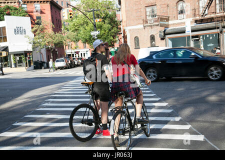 Cyclists on 7th Avenue South in The Village, NY - USA Stock Photo