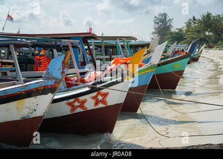 Boats on a beach in Bangka Island Stock Photo