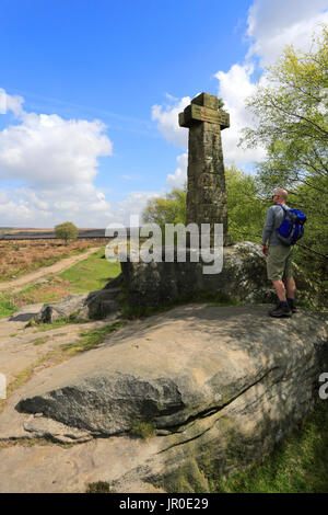 Walker at the Wellington Monument dedicated to the Duke of Wellington, Baslow Edge; Derbyshire County; Peak District National Park; England; UK Stock Photo