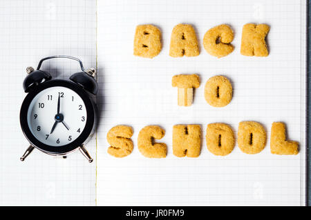 Back to school written with cookies on a notebook Stock Photo