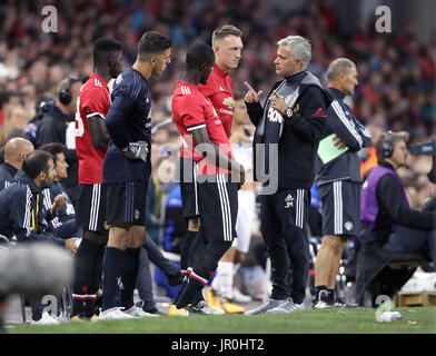 Manchester United manager Jose Mourinho speaks to Phil Jones during the pre-season friendly match at the Aviva Stadium, Dublin. Stock Photo