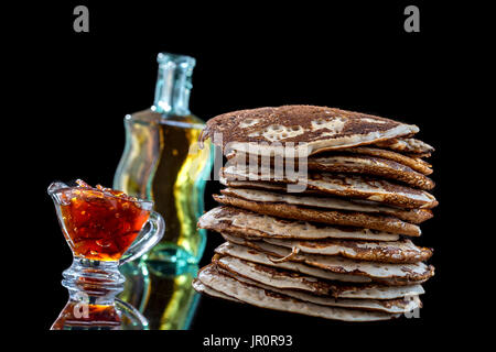 Glutten-free pancakes with jam and Maple syrup, bio healthy ingredients, on black Stock Photo