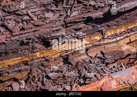 Crumbling stone containing hematite and quartz Stock Photo
