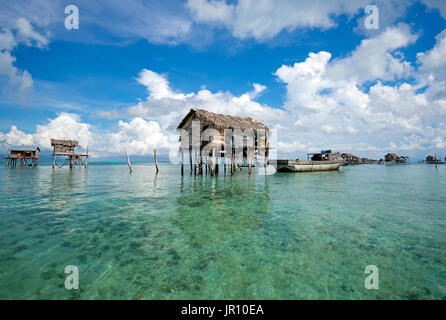 Semporna, Malaysia - 19 April, 2015: A Bajau floating village of stilted houses off the coast of Borneo in The Celebes Sea in the vicinity of Sipidan  Stock Photo
