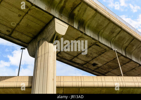 View from below of two highway junctions crossing one above the other. Stock Photo