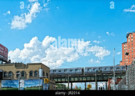 Elevated Subway Train Passing Through Coney Island, Brooklyn, NY, USA Stock Photo