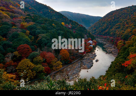 Autumn colors along the Katsura River in the Arashiyama area of Kyoto, Japan just after sunset Stock Photo