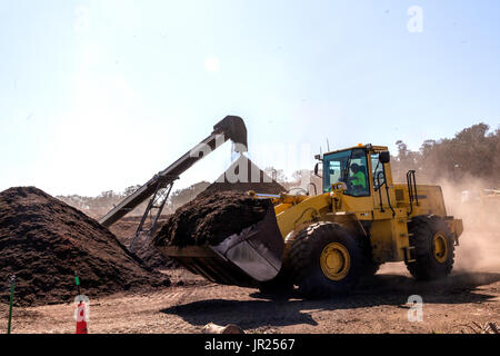 Front end loader moving compost Stock Photo - Alamy