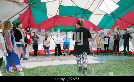 People Doing Yoga Glastonbury Festival UK Stock Photo