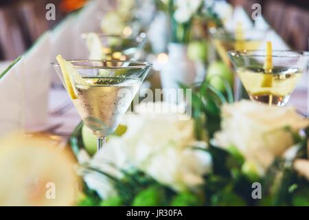 Wedding (birthday) celebrations party. Glasses with an aperitif on a table in a restaurant. Stock Photo