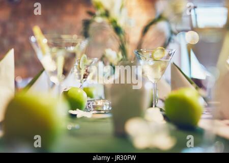 Wedding (birthday) celebrations party. Glasses with an aperitif on a table in a restaurant. Stock Photo