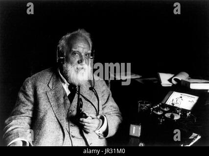 Bell with photophone, holding pipe, and wearing headphones. The photophone (later given the alternate name radiophone) was similar to a contemporary telephone, except that it used modulated light as a means of wireless transmission while the telephone relied on modulated electricity carried over a conductive wire circuit. It was invented jointly by Alexander Graham Bell and his assistant Charles Sumner Tainter on February 19, 1880. Bell believed the photophone was his most important invention. Of the 18 patents granted in Bell's name alone, and the 12 he shared with his collaborators, four wer Stock Photo