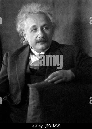Albert Einstein (March 14, 1879 - April 18, 1955) was a German-born theoretical physicist. He developed the general theory of relativity, one of the two pillars of modern physics. He is best known in popular culture for his mass-energy equivalence formula E = mc2. He received the 1921 Nobel Prize in Physics 'for his services to Theoretical Physics, and especially for his discovery of the law of the photoelectric effect'. He was visiting the US when Hitler came to power in 1933, and did not go back to Germany. He settled in America becoming a citizen in 1940. He helped alert President Roosevelt Stock Photo