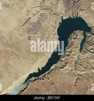 Longyangxia Dam Solar Park in China, the largest solar farm in the world as of February 2017, captured by the Operational Land Imager (OLI) on Landsat 8. Water in the dam's reservoir is used for irrigation and hydroelectric power. Stock Photo