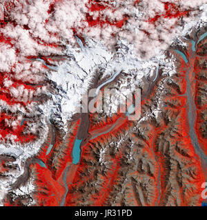 New Zealand's Tasman Glacier on January 29, 2017, taken by the Advanced Spaceborne Thermal Emission and Reflection Radiometer on NASA's Terra satellite. Compare with JG5750 from 1990, to see how the glacier is receding. In this false-color image, white is snow and ice, red is vegetation, blue is water, and brown is soil (including moraines and sediment-covered glaciers). Stock Photo