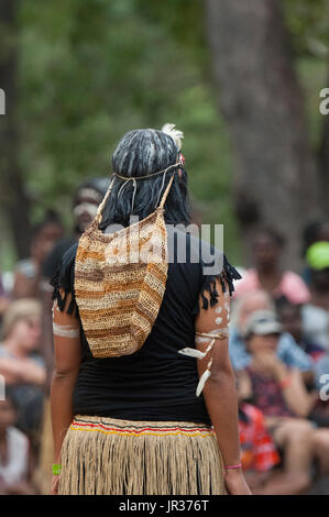 Woman performer carrying a woven bag around her head, Laura Aboriginal Dance Festival, Laura, Cape York, Far North Queensland, FNQ, QLD, Australia Stock Photo