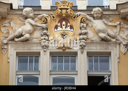 Coat of arms of Prague depicted on the main facade of the Pražská městská pojišťovna (Prague City Insurance Company) in Old Town Square in Prague, Czech Republic. The building designed by Czech architect Osvald Polívka in Baroque revival style was built in 1898- 1901. The building is now served as the seat of the Ministry of Regional Development of the Czech Republic. Stock Photo