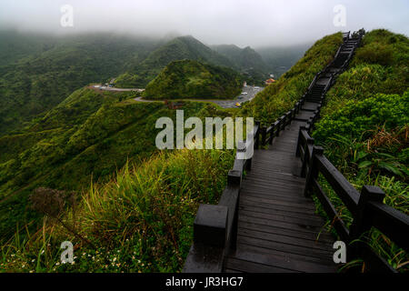 Boardwalk on a mountain ridge in Jiufen, Taiwan along the coast of the Yinyang sea Stock Photo