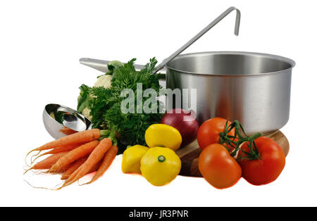 Soup vegetables including carrots, onion, squash, tomatoes with large stainless steel cooking pot and ladle isolated on white background Stock Photo