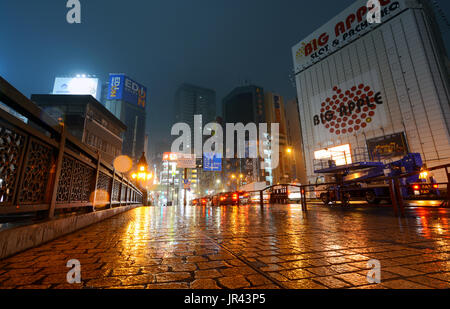 TOKYO, JAPAN - APRIL 8, 2017 - Traffic crosses the bridge to Tokyo's Akihabara district on a rainy night Stock Photo