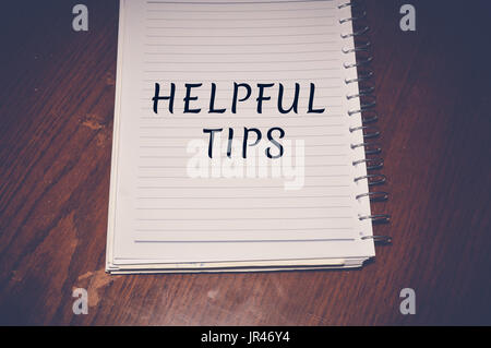 Helpful Tips written on white paper, business concept background Stock Photo