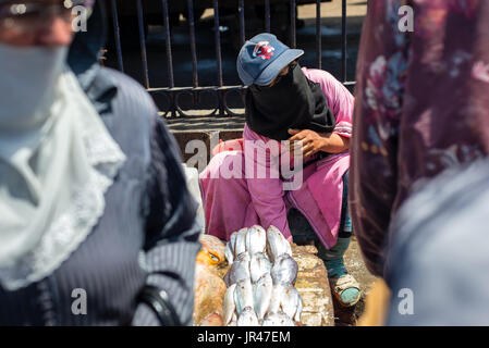 Woman selling fish on the street Stock Photo