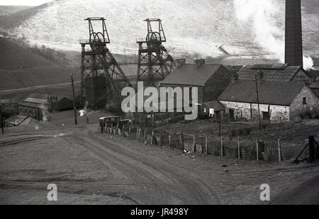 1940s, historical, picture from above the ground of a working coal mine near Dowlais, Merthyr Tydfil, South Wales, UK showing the two steel winding towers or headframes. This mine once supplied the coal for the local ironworks. Stock Photo