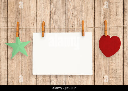 blank white paper hanging with cloth peg Stock Photo