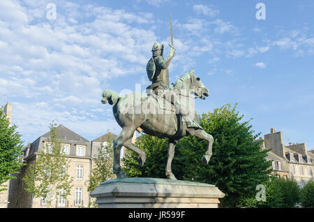 Statue of knight on horseback in Place du Guesclin in the historic town of Dinan in the Cotes D'Armor, Brittany, France Stock Photo