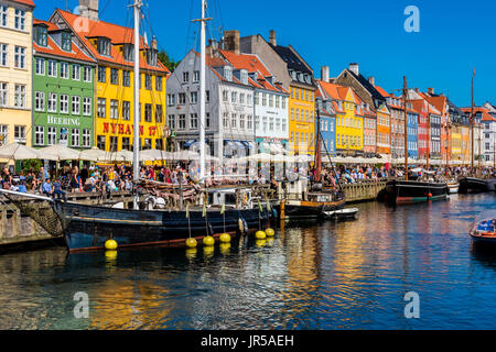 Nyhavn harbor and promenade in Copenhagen, Denmark. Nyhavn is the most famous landmark of Copenhagen. Stock Photo