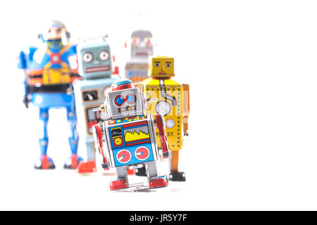 Group of Retro Tin Robots on a white background with copy space Stock Photo