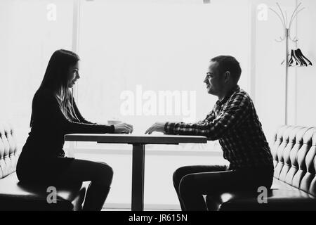 Man and woman in discussions in the restaurant Stock Photo