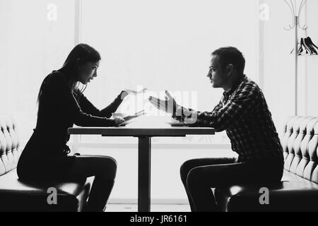 Man and woman in discussions in the restaurant Stock Photo