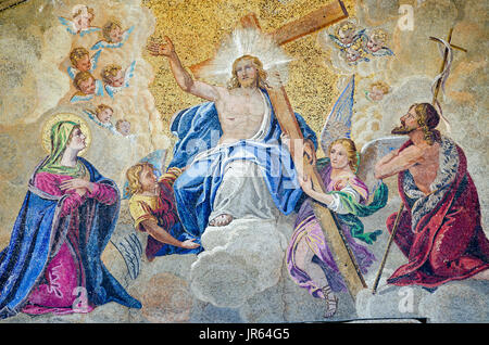 Mosaic showing the Last Judgement on the exterior of St Mark's Cathedral in Venice, Italy.  Historic mosaic, viewed on facade from public pavement. Stock Photo