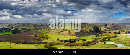 Landscape with farmland and cloudy sky, North Island, New Zealand Stock Photo