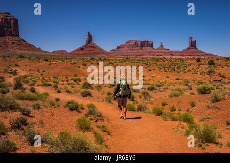 Man hiking, West Mitten Butte, Monument Valley, Arizona, America, USA Stock Photo